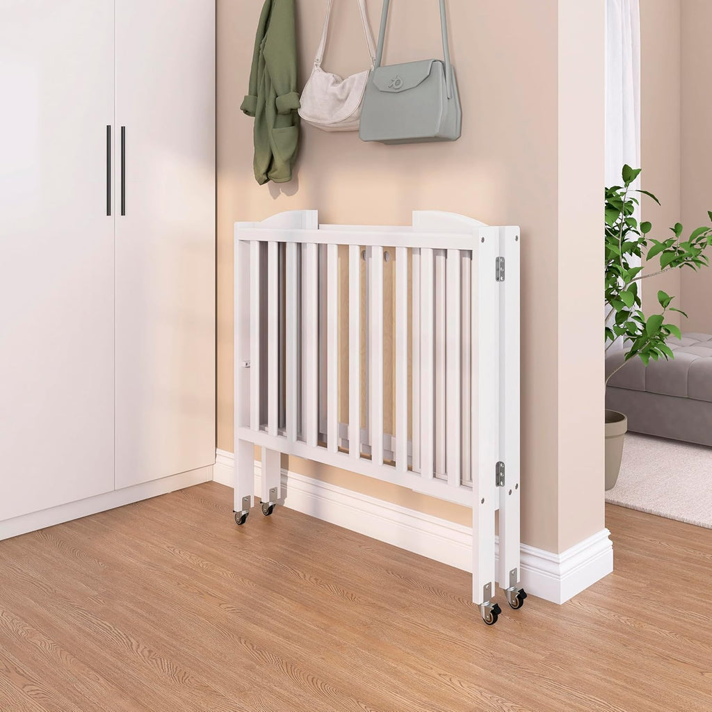 Dream On Me 2-in-1 Portable Mini Crib, Non-Full Size Baby Crib for Small Spaces, 2 Mattress Heights, Compact Travel Design, Includes Mattress, GREENGUARD Gold & BSA Certified, White