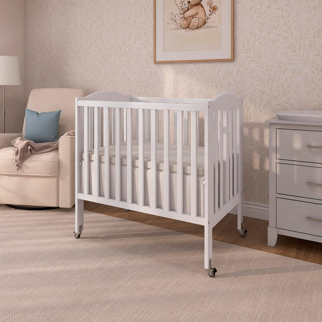 Dream On Me 2-in-1 Portable Mini Crib, Non-Full Size Baby Crib for Small Spaces, 2 Mattress Heights, Compact Travel Design, Includes Mattress, GREENGUARD Gold & BSA Certified, White
