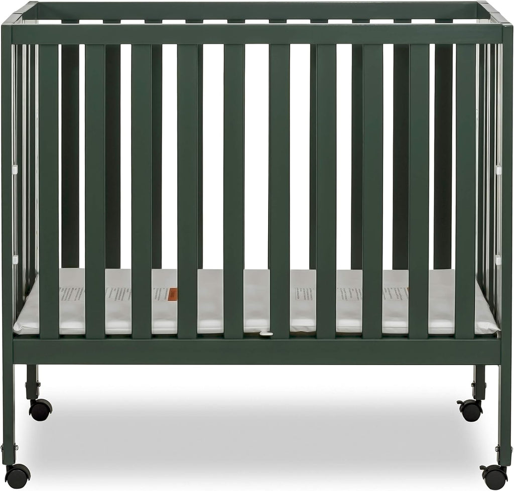 Dream On Me Jett Mini Folding Baby Crib in Olive, GreenGuard Gold & BSA, Lightweight & Portable, Patented Flat Folding System for Small Spaces & Travel, 1.5” Mattress Pad, 3 Heights, Safe Wheels